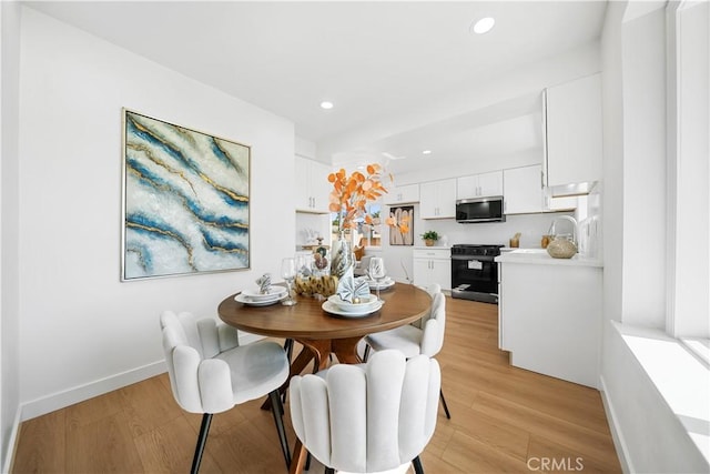 dining room featuring light hardwood / wood-style flooring