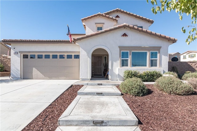 mediterranean / spanish house featuring a garage