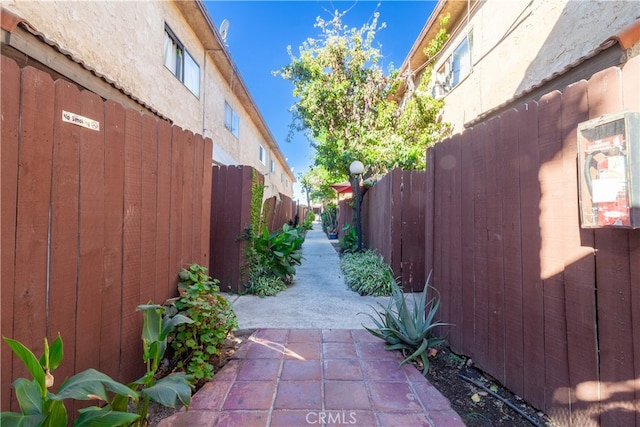 view of side of property with a patio area