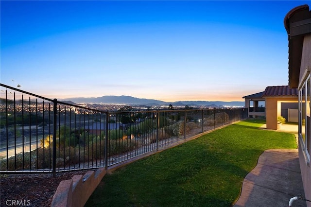 yard at dusk with a mountain view