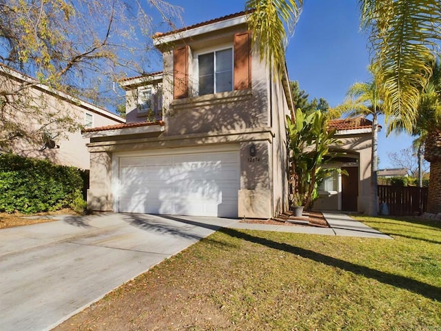 view of front of home featuring a garage and a front lawn