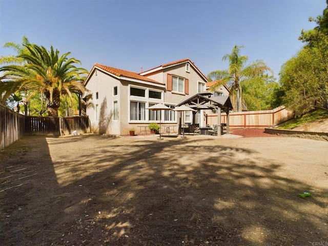 back of house featuring a patio