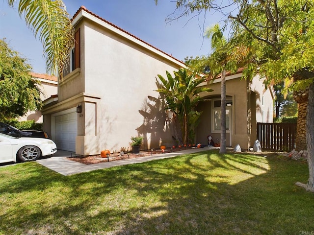 exterior space featuring a garage and a front lawn