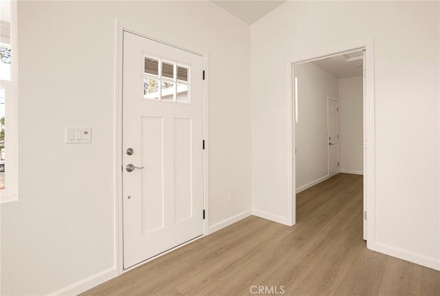 13990 Pineland Cir, Magalia, CA 95954 - foyer featuring light wood-type flooring, baseboards, and healthy amount of natural light