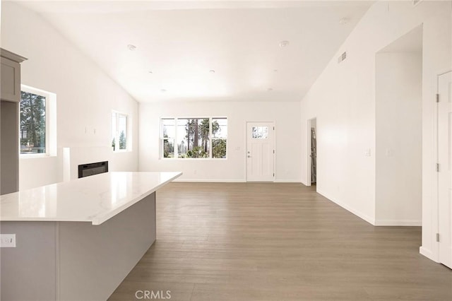 13990 Pineland Cir, Magalia, CA 95954 - kitchen featuring light wood-type flooring, light countertops, baseboards, and open floor plan