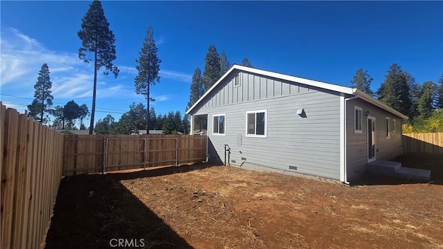 13990 Pineland Cir, Magalia, CA 95954 - view of property exterior with crawl space, a fenced backyard, and board and batten siding