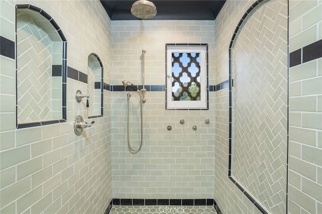 bathroom with a tile shower