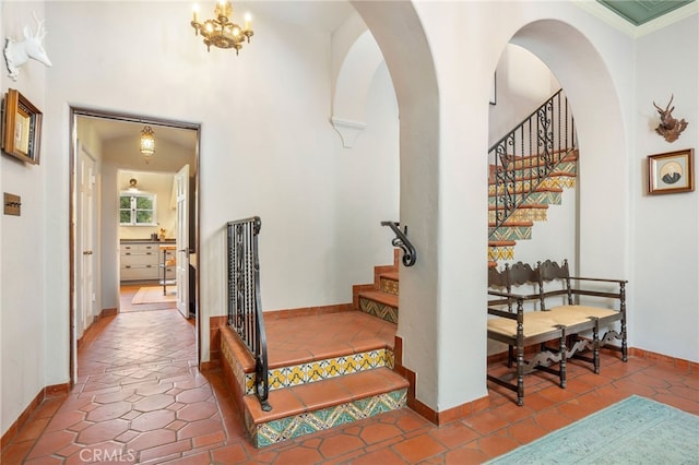 hallway featuring a chandelier