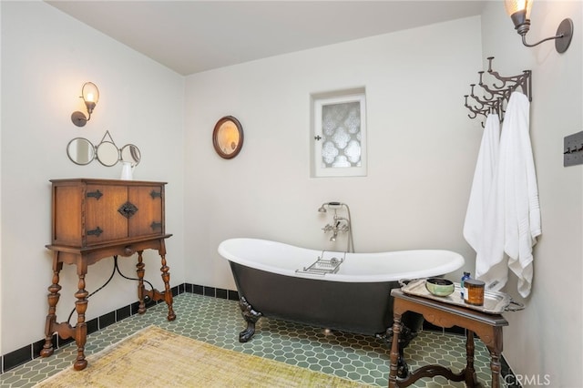 bathroom with a tub to relax in