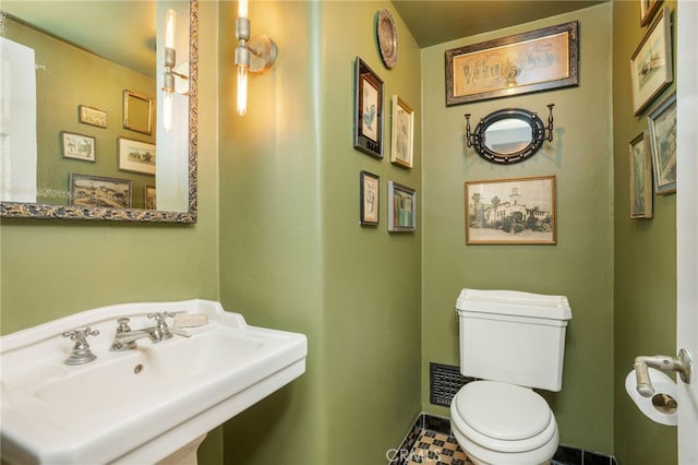 bathroom featuring sink and toilet