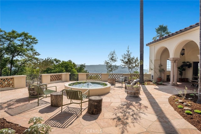 view of patio featuring a water view