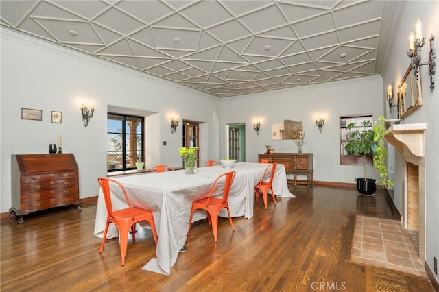 dining room featuring ornamental molding and dark wood-type flooring