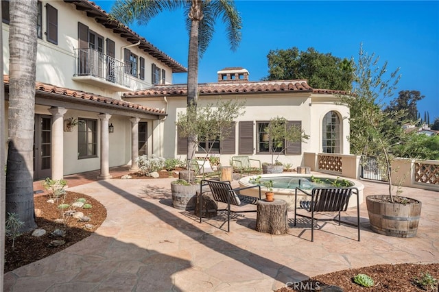 view of patio with a balcony