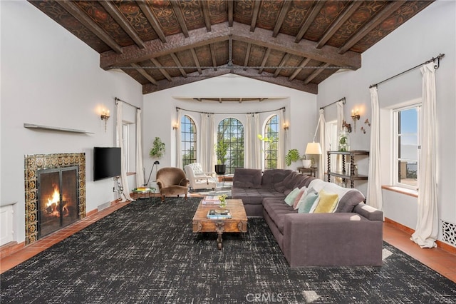 tiled living room featuring vaulted ceiling with beams