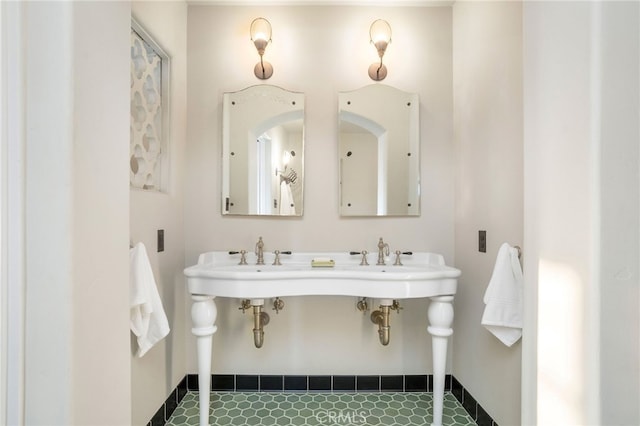 bathroom with tile patterned floors and dual sinks