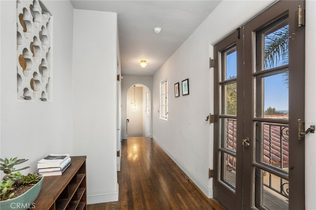 hallway with dark hardwood / wood-style floors