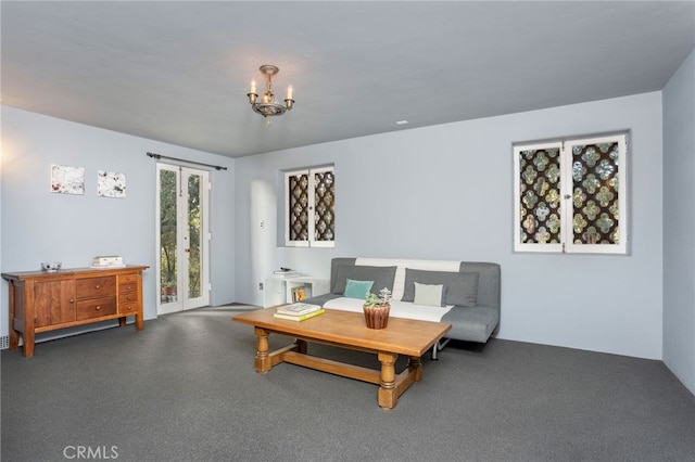 living room with an inviting chandelier