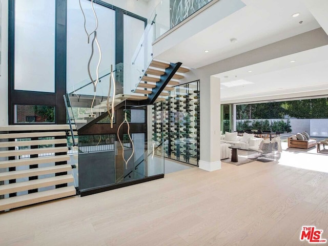 wine room with hardwood / wood-style flooring