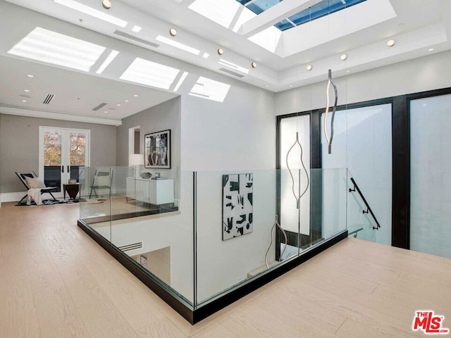 reception with french doors and a skylight