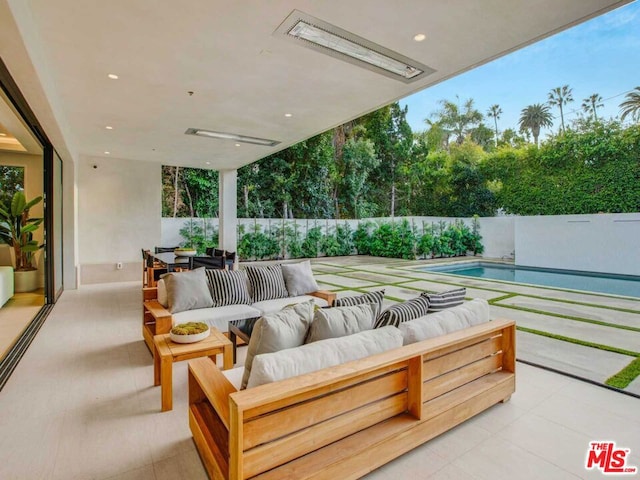 view of patio with a fenced in pool