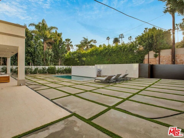 view of patio / terrace featuring a fenced in pool