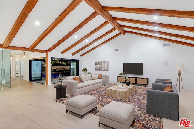 living room with beam ceiling, high vaulted ceiling, and light hardwood / wood-style flooring