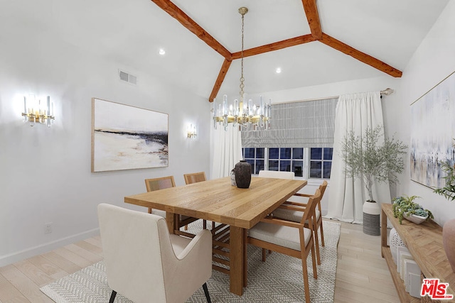 dining space featuring lofted ceiling with beams, light hardwood / wood-style floors, and a chandelier