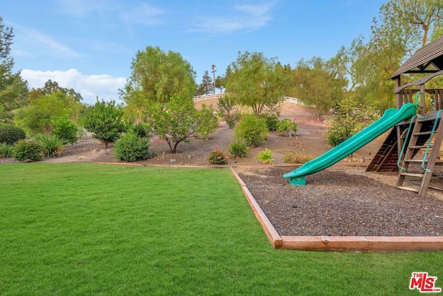 view of playground featuring a lawn