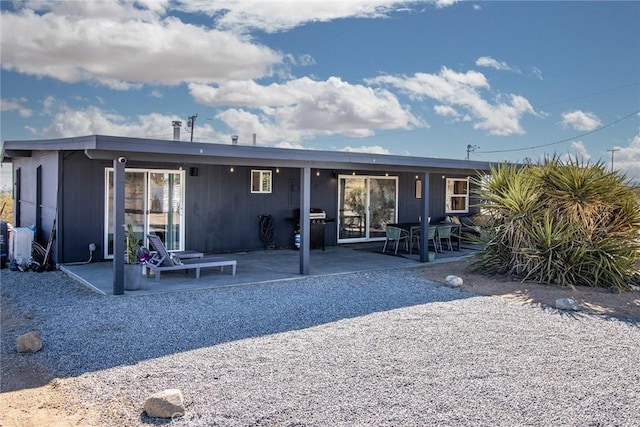 back of house featuring a patio area