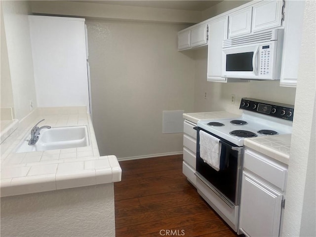 kitchen featuring white cabinetry, tile counters, white appliances, and sink