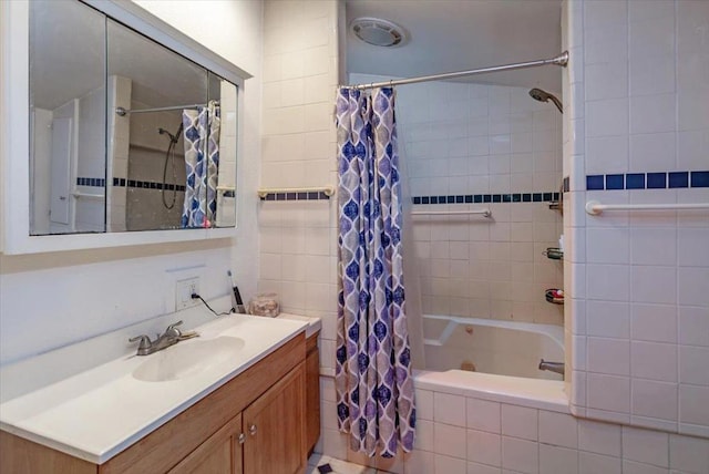 bathroom featuring vanity and shower / bath combo with shower curtain