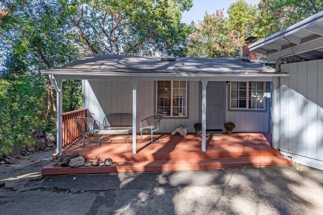 rear view of property with a deck