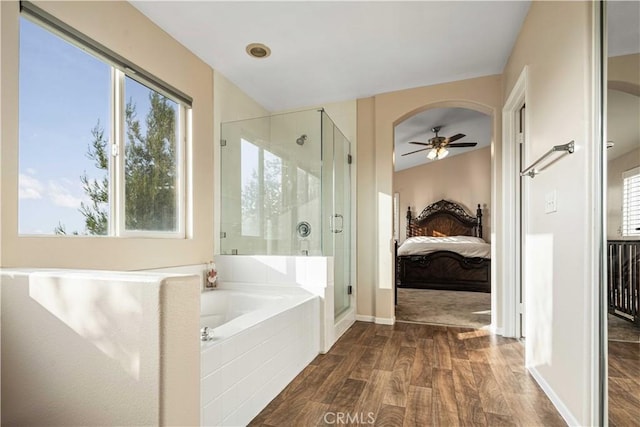 26527 Cardinal Dr, Canyon Country, CA 91387 - ensuite bathroom featuring a stall shower, a bath, wood finished floors, and ceiling fan