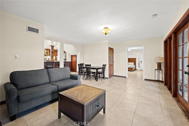 living room with light tile patterned floors