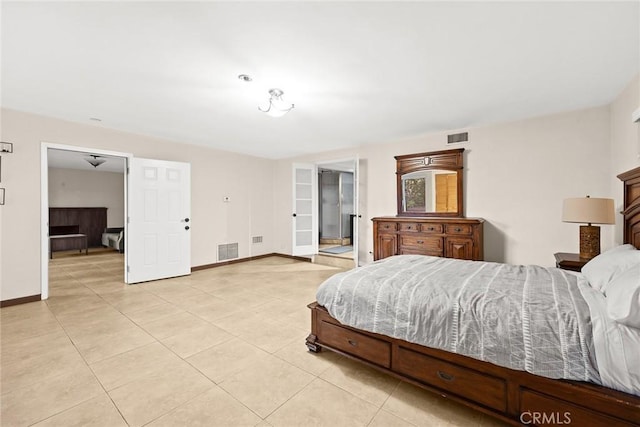 bedroom with light tile patterned floors