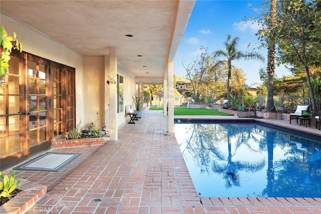 view of swimming pool featuring a patio area