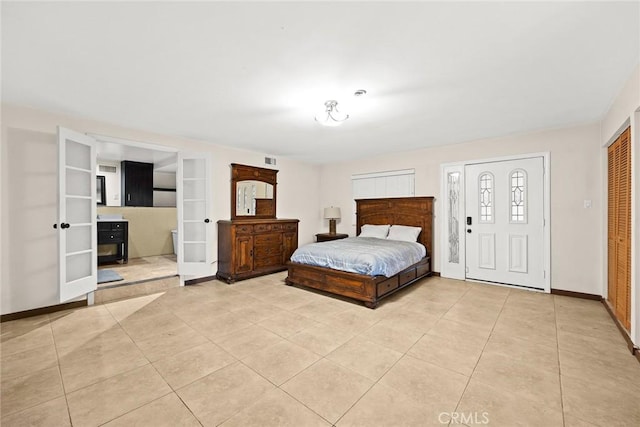 bedroom featuring french doors and light tile patterned floors