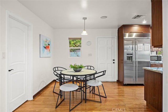 dining room featuring light hardwood / wood-style floors