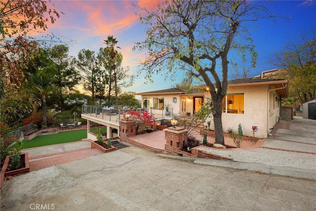 view of front of house featuring a patio and a deck