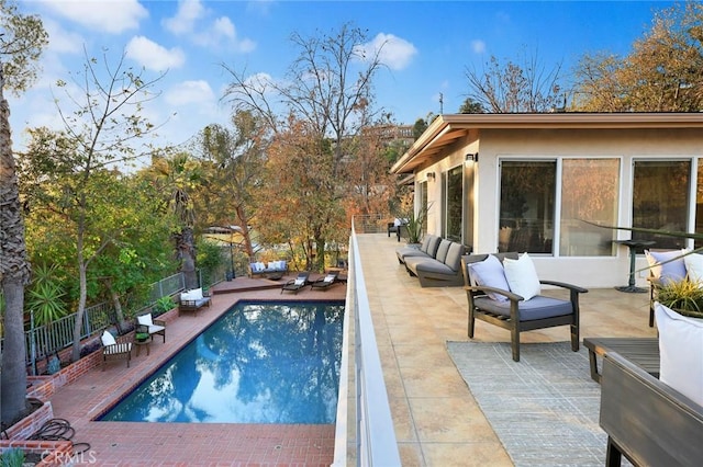 view of pool with a patio area and an outdoor hangout area