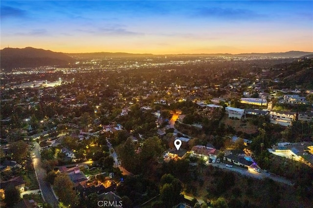 aerial view at dusk with a mountain view