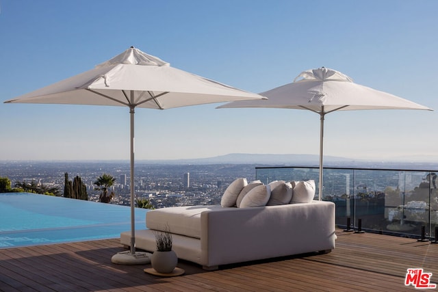 wooden terrace featuring an outdoor hangout area