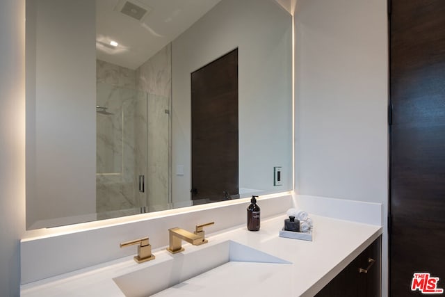 bathroom with vanity and walk in shower