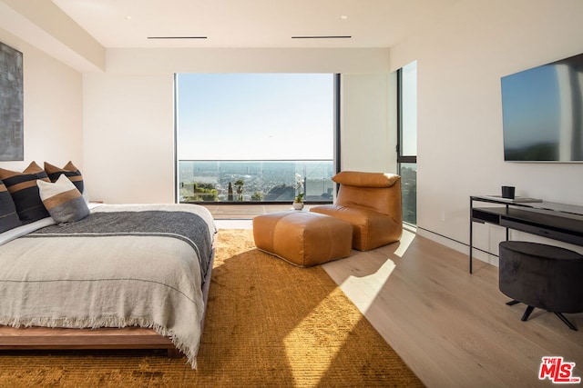 bedroom featuring hardwood / wood-style flooring