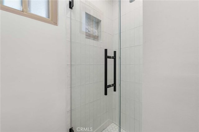 bathroom featuring walk in shower