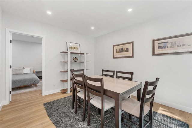 dining area featuring light wood-type flooring