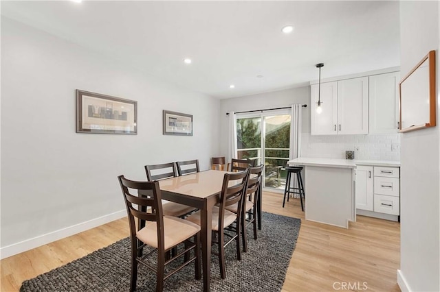 dining area with light wood-type flooring