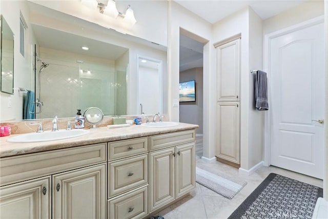 bathroom with vanity and a shower with door