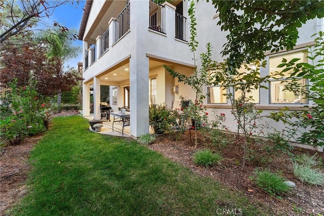 exterior space featuring a balcony and a patio