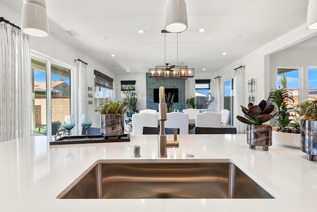 kitchen featuring sink and decorative light fixtures